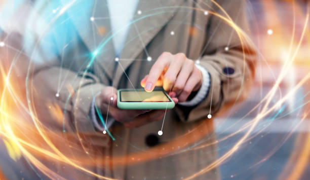 istock Young woman with smartphone in her hands. Outdoors. Global networking concept 2180433527