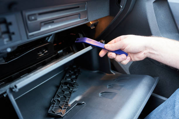 istock Closeup of man's hand fixing a car air conditioner. 2180438465