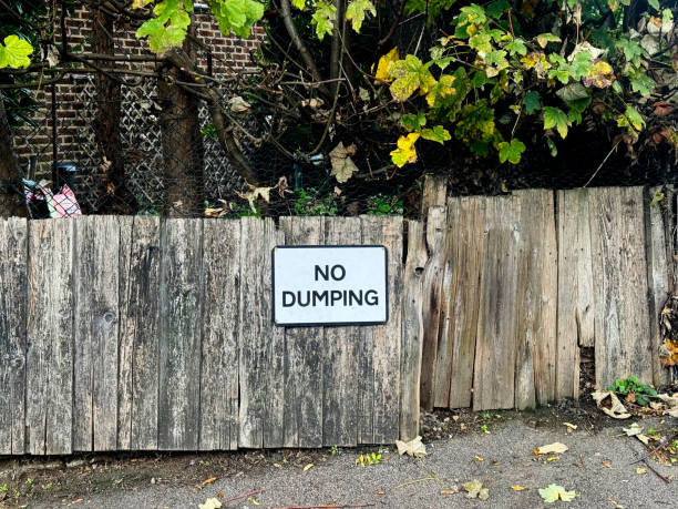 istock No dumping sign on a street 2180439029