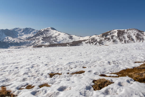istock Zirbitzkogel - Snow covered alpine pasture with panoramic view on snow capped mountain peak Zirbitzkogel and Kreiskogel in Seetal Alps 2180441500