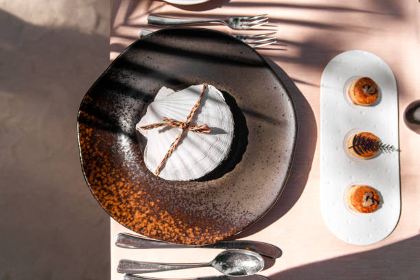Woman setting table for dinner at home, closeup