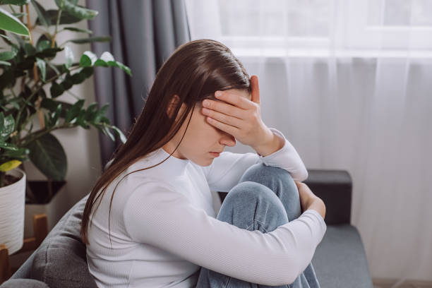 istock Depressed unhappy young brunette woman expression face thinking about problem sitting on couch, difficulty, feeling failure and exhausted, suffering from loneliness, grief sorrow and bad relationship 2180443211