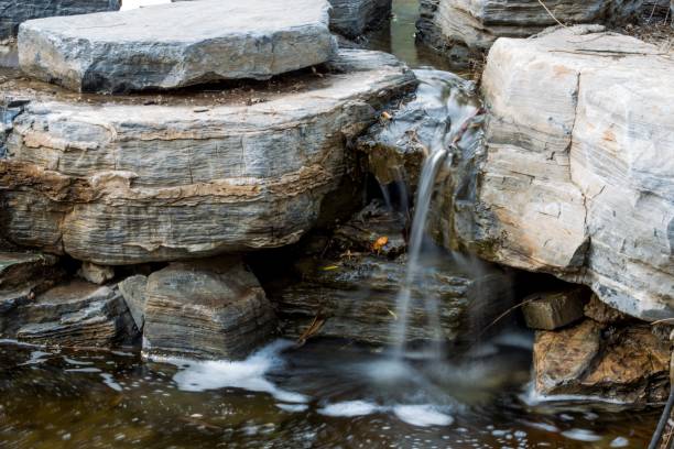 istock Small waterfall in a rocky landscape 2180443931