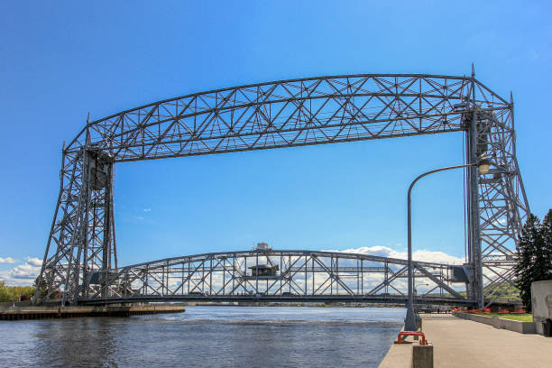 Photography of the entire structure of an old iron railway bridge , strong framework