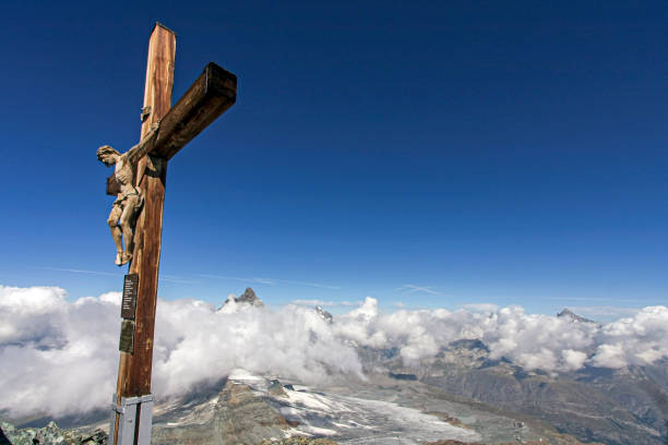 istock Mountain peak in the Alps with cross 2180454245