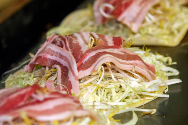 istock Japanese pancake with soybeans and bacon 2180454282