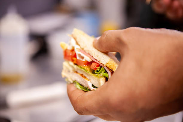 istock Chef making sandwich in rustic style with bacon and fresh vegetables 2180456951