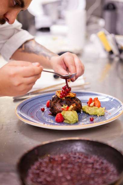 istock Professional food decoration in restaurant kitchen 2180457081