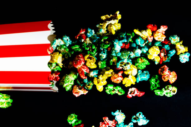 Tasty popcorn in buckets and cold cola drinks with cinema tickets, movie clapper and 3D eyeglasses isolated on white background. Cinema concept. Watching a movie.