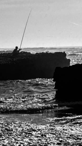 istock Black and white fisherman 2180467057