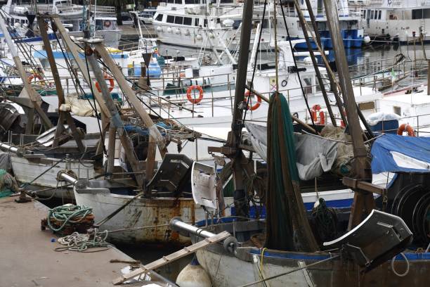 istock Fishing boats in dock with tackle 2180467855