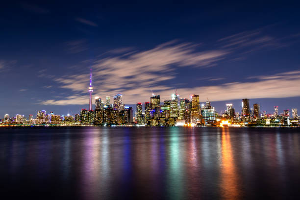 istock City skyline is reflected in water at night, creating a stunning view 2180470109