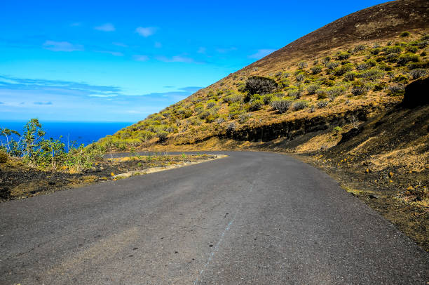 istock A road with a hill in the background 2180470777