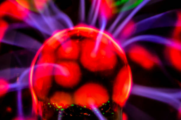 A glowing red ball with purple and blue streaks. The ball is surrounded by a purple and blue glow