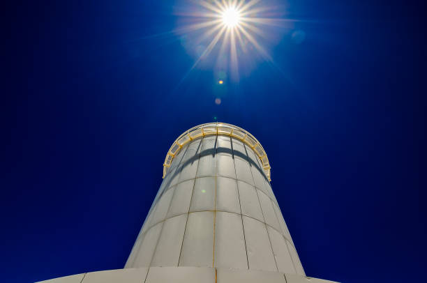 istock A tall white tower with a blue sky in the background 2180470804