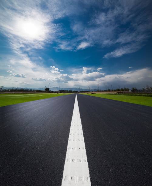 Long and straight road under the blue sky