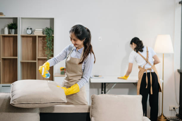 istock Efficient and professional housekeeping with our dynamic cleaning duo. Perfect teamwork ensures spotless cleanliness 2180472208
