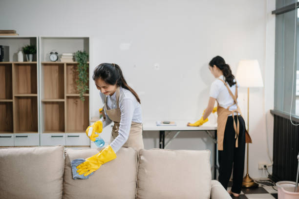 istock Efficient and professional housekeeping with our dynamic cleaning duo. Perfect teamwork ensures spotless cleanliness 2180472209