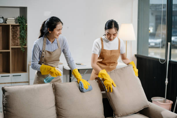 istock Efficient and professional housekeeping with our dynamic cleaning duo. Perfect teamwork ensures spotless cleanliness in every home. 2180472235