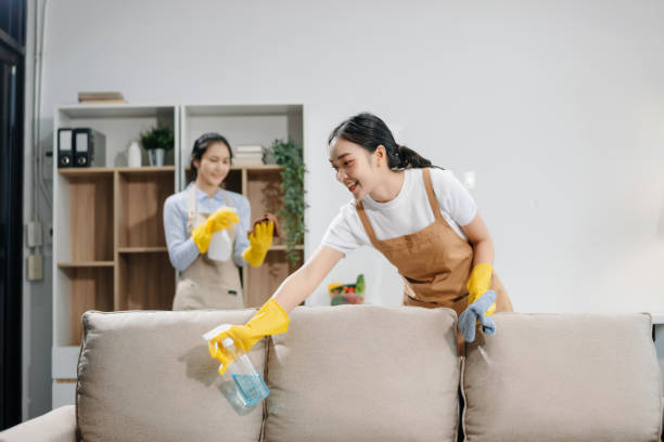 istock Efficient and professional housekeeping with our dynamic cleaning duo. Perfect teamwork ensures spotless cleanliness 2180472244