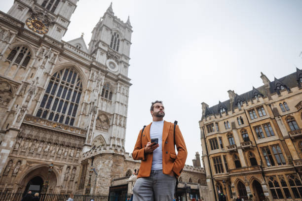 istock Man Exploring Westminster Abbey in London 2180472537