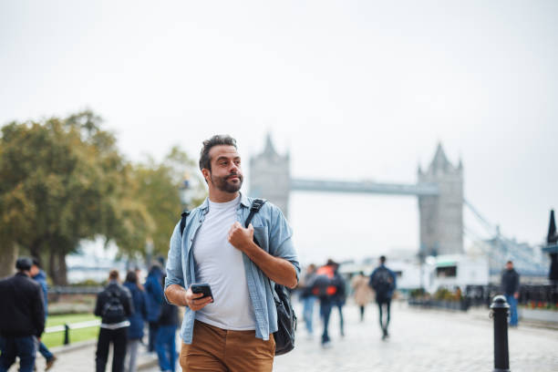 istock Man Exploring London Near Tower Bridge 2180472545