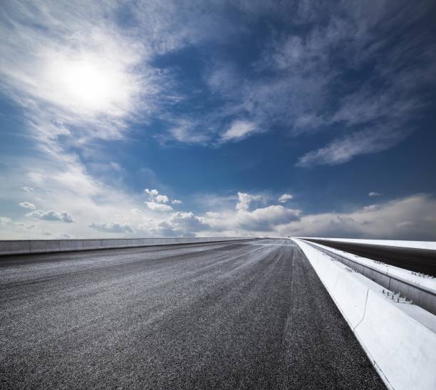 istock New asphalt road under the blue sky 2180476138