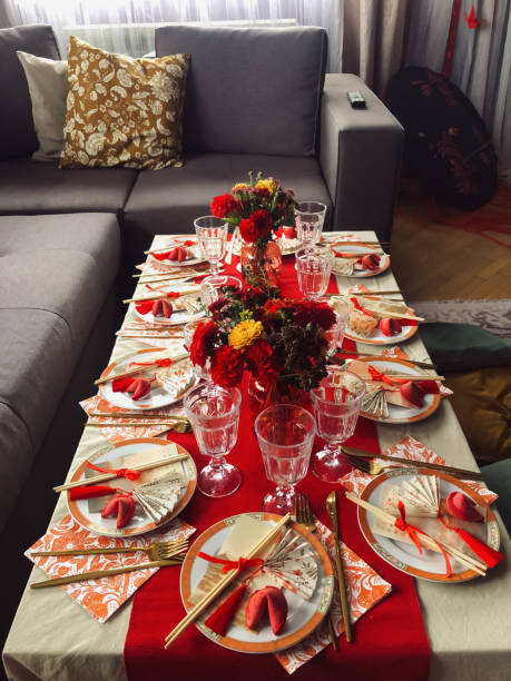 Chinese Festive Dining Table with Red and Yellow Accents, Cozy Home Setting, Vertical Close-Up View