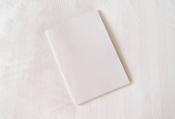 istock White magazine mockup on white hotel bed 2180481130