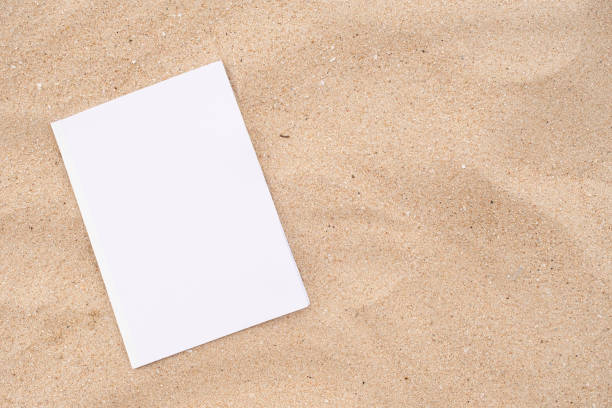istock blank magazine mockup on sandy beach 2180481329