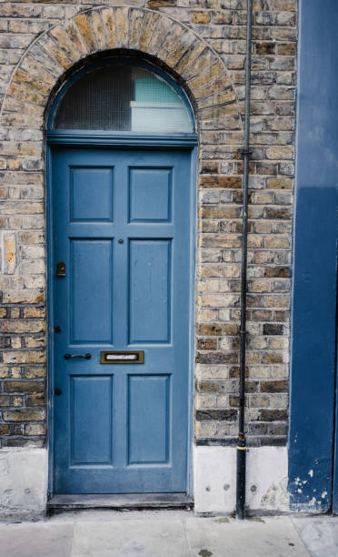 istock Victorian Blue door with brown brick 2180481385