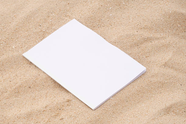 istock blank magazine mockup on sandy beach 2180481576