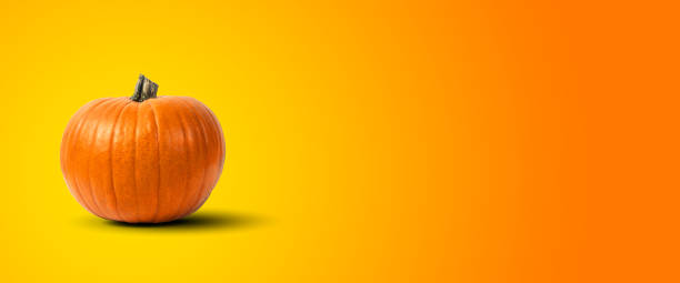 istock web banner with halloween pumpkin jack o' lantern on a yellow and orange gradient background 2180485644