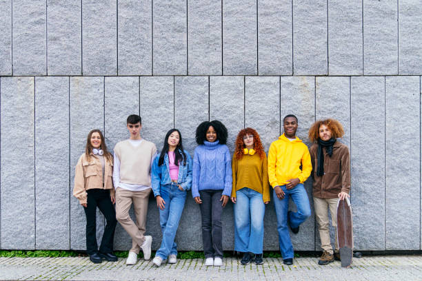 istock Group of diverse young people posing against a wall 2180491541
