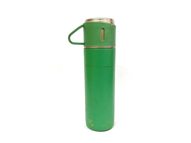 istock Green tumbler isolated on white background 2180491671