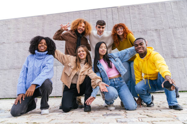 istock Group of multiethnic friends is having fun posing for a photo 2180493496