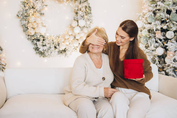 istock Heartwarming Christmas Surprise With Generational Bonding and Gift Giving 2180498913