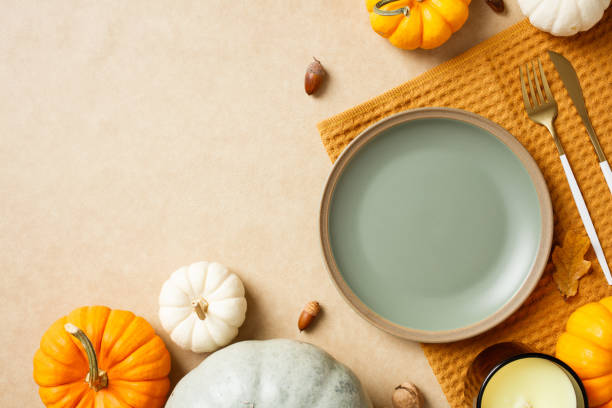 istock Autumn dining table setting with pumpkins and rustic decor. Thanksgiving, fall season culinary concept 2180504924