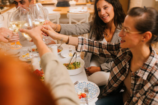 istock Friends toast with wine glasses 2180506541