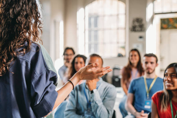 istock Group of people sitting during a meeting 2180507008