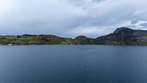 istock Tranquil fjord Surrounded by Hills and Mountains 2180521663