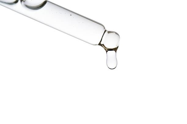istock Dropper pipette with delicious serum with bubbles close-up. 2180526595