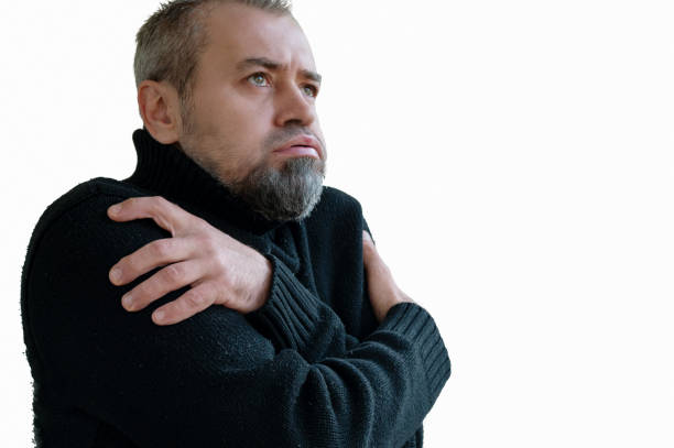 istock Frozen man shivering from cold weather on a white background. Winter cold concept 2180530666