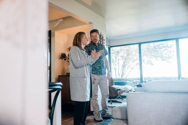 istock real estate agent Discussing Home Property With Client 2180531011