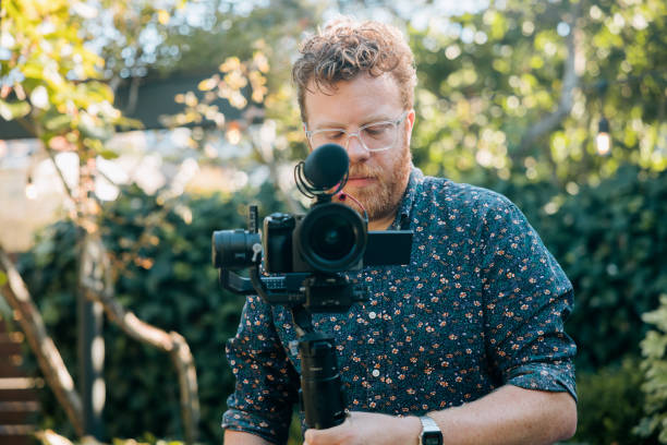 real estate agent Doing Video Work For Home Listing stock photo