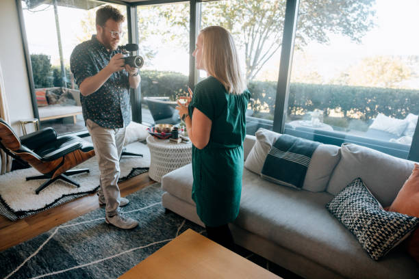 istock real estate agent Doing Video Work For Home Listing 2180531239