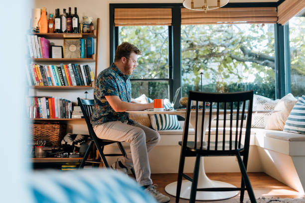 istock Man Hot Desking From Kitchen Breakfast Nook 2180531363