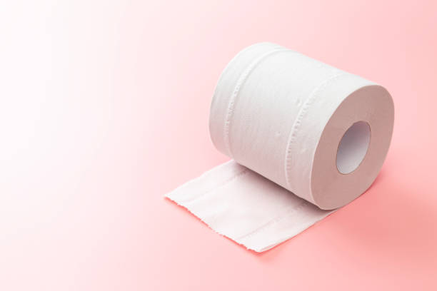 istock Toilet paper on a pink background 2180533592