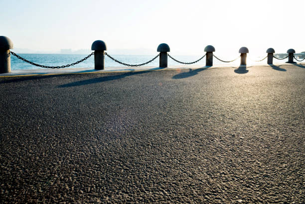 Sidewalk with railing by the sea