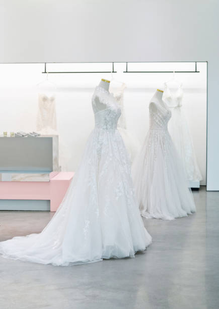 istock Beautiful wedding dresses in the store 2180536482